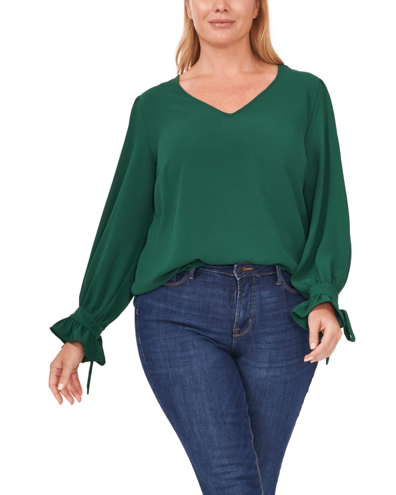 Front of a model wearing a size 1X Isla Tie-Sleeve Blouse in 454-Alpine Green by CeCe. | dia_product_style_image_id:263559
